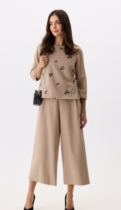 Beżowe spodnie culotte z szeroką nogawką